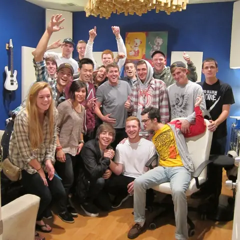 About twenty friends cheering in the control room, 2011