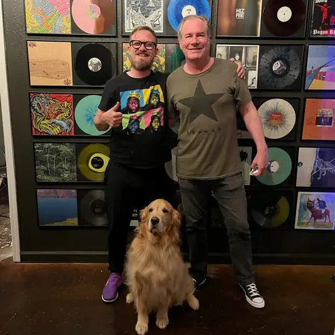 Sam Pura, a friend and the studio dog at the Wall of Fame, 2023
