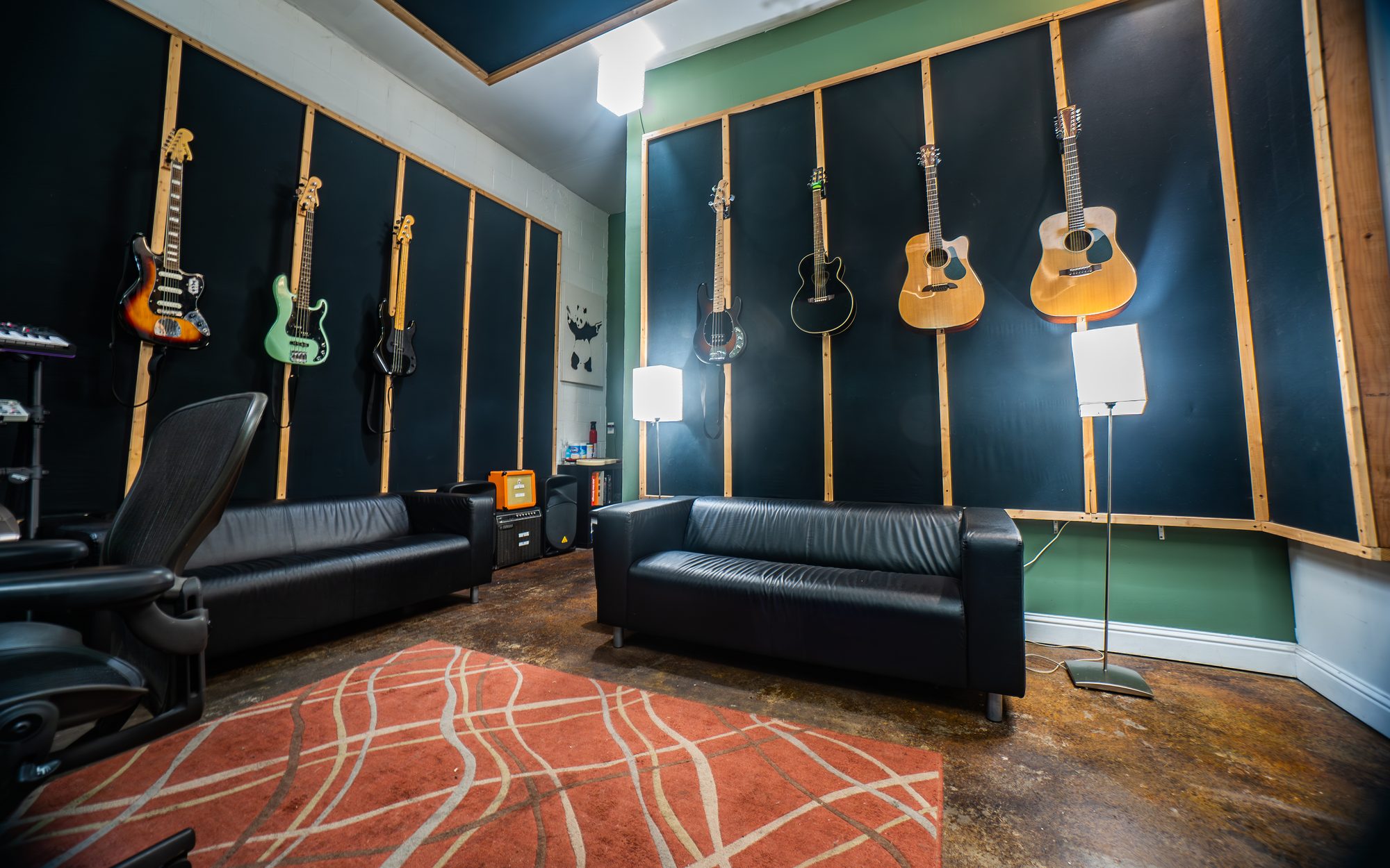 Panda East control room with guitars and analog synths