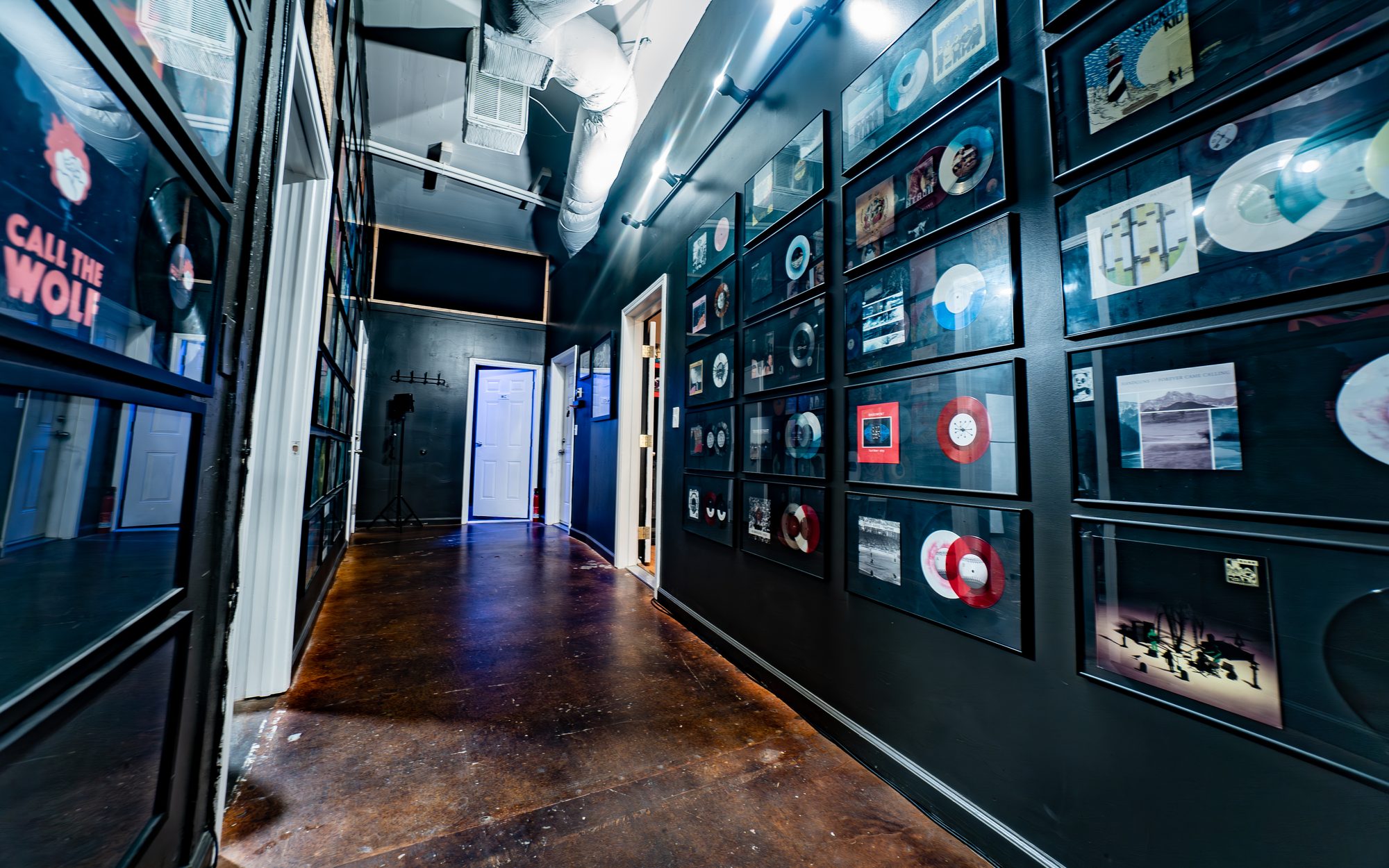 Record and display wall at The Panda Studios