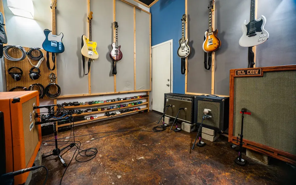 Isolation room with guitars, amps and pedals